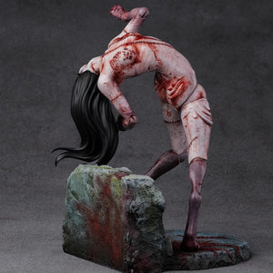 Left side view of the Kashimashi statue emphasizing the long, flowing black hair and the hunched, predatory stance.