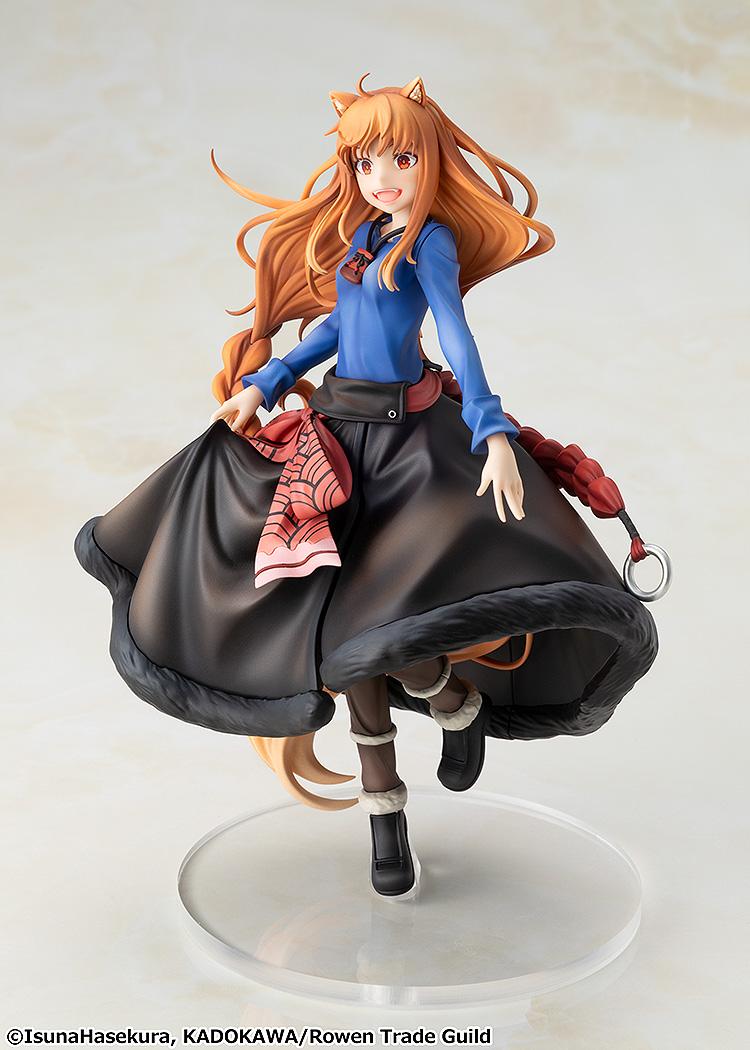 Three-quarter studio view of the Spice and Wolf Holo figure lifting the edges of her flared skirt in a dance pose.