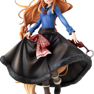 Cutout front view of the KD Colle Spice and Wolf Holo figure dancing in her blue shirt and dark skirt.
