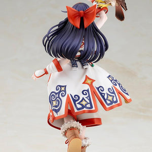 Back view of Nakoruru figure showing her red hair bow, long dark hair, and patterned white robe
