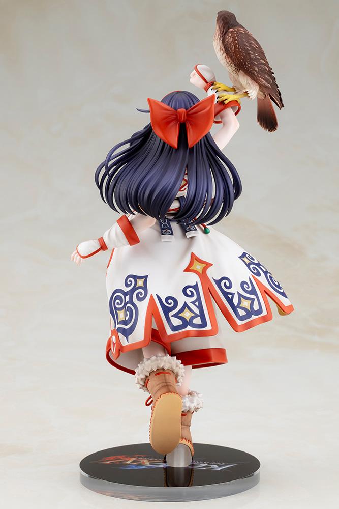 Back view of Nakoruru figure showing her red hair bow, long dark hair, and patterned white robe