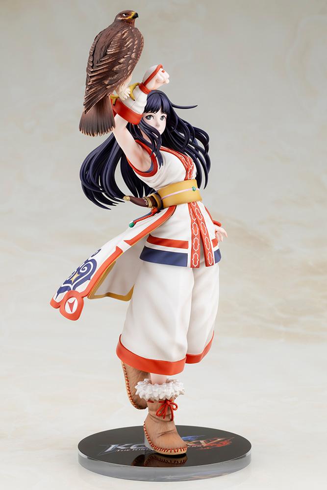 Front three-quarter standing shot of Nakoruru figure mounted on the KOF XV logo display stand