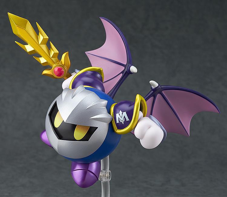 Action-oriented aerial pose of the Meta Knight Nendoroid using a clear support arm, featuring his iconic wings and sword raised for battle.