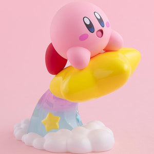 Studio front-facing profile of the pink Kirby figure riding a Warp Star, showcased against a solid pastel pink background.