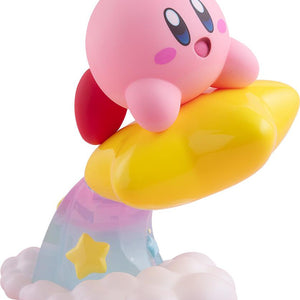 Studio side profile view of the POP UP PARADE Kirby figure riding a glossy yellow Warp Star, leaving a translucent rainbow cloud trail with yellow stars.