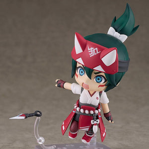 Action pose of the Kiriko Nendoroid figure featuring her combat face plate with blue glowing eyes as she throws a kunai dagger on a clear plastic effect piece.