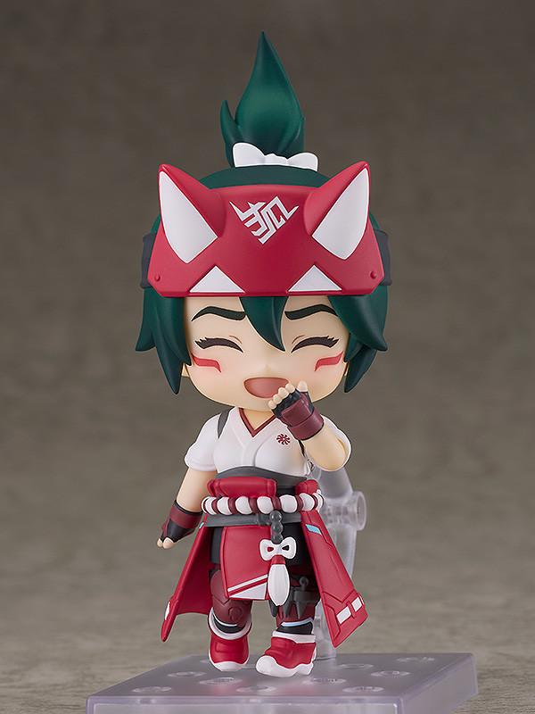 Adorable posing of the Kiriko Nendoroid figure showing her smiling face plate while giggling with a hand covering her mouth.