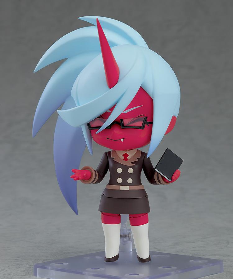 Close-up view of the Kneesocks Nendoroid figure with a subtle smiling face plate, holding her signature black book accessory.