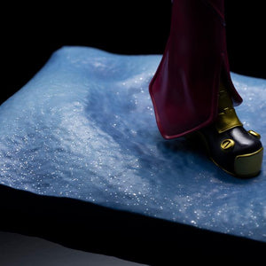 Textured look at the sparkling snowy field diorama base of the Kotobukiya Kula Diamond statue under moody directional spotlighting.