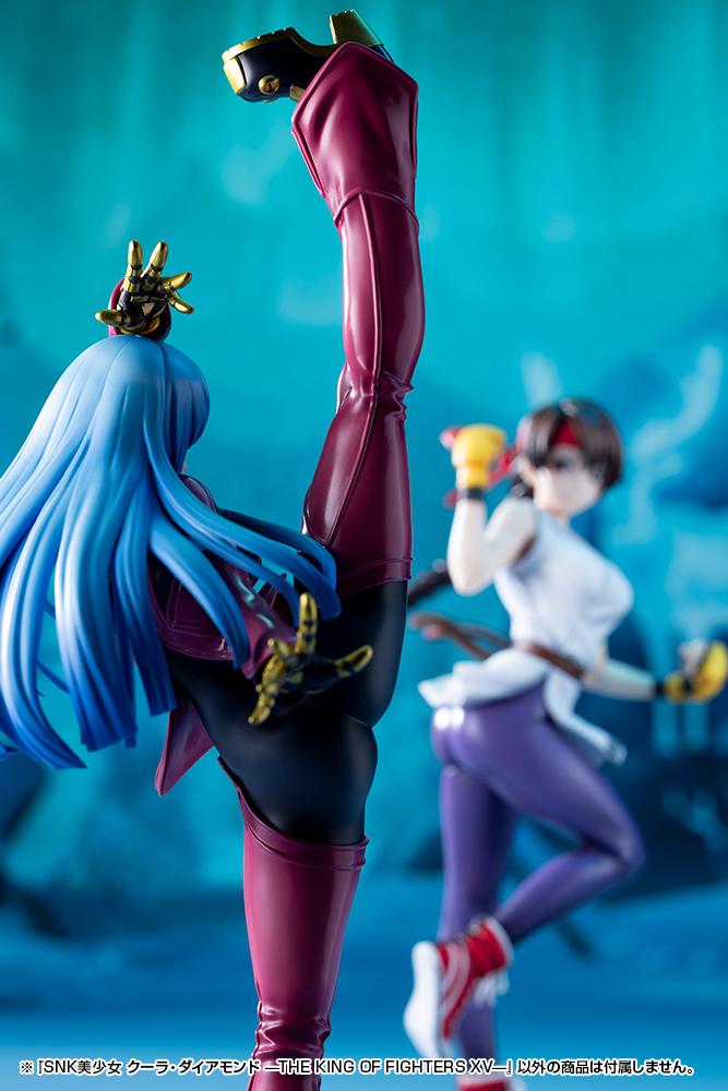 Rear close-up of Kula Diamond's high kick pose with a blurred background showing the Mai Shiranui figure ready for combat.