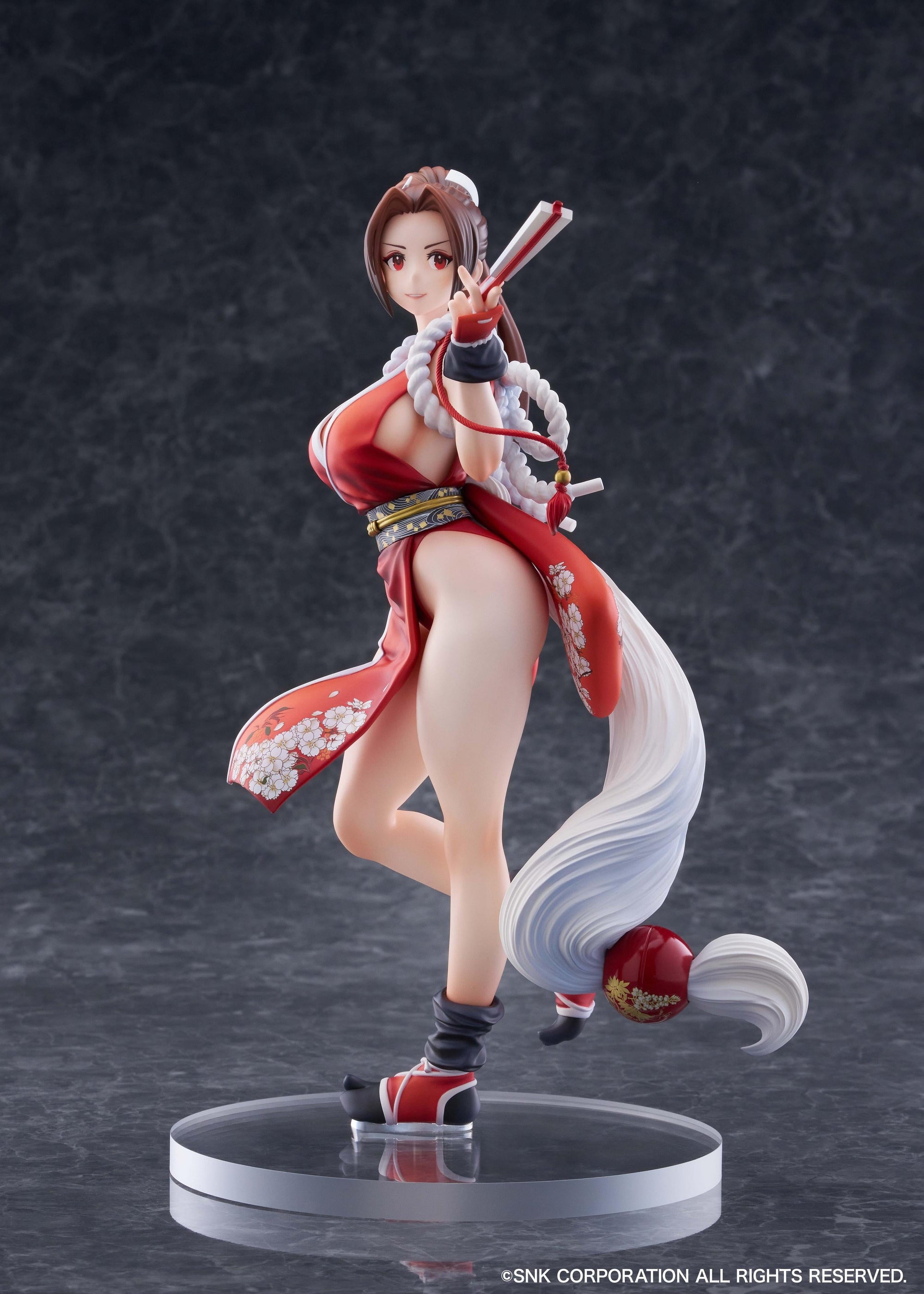 Dynamic side view of the Mai Shiranui figure holding her signature folding fan.