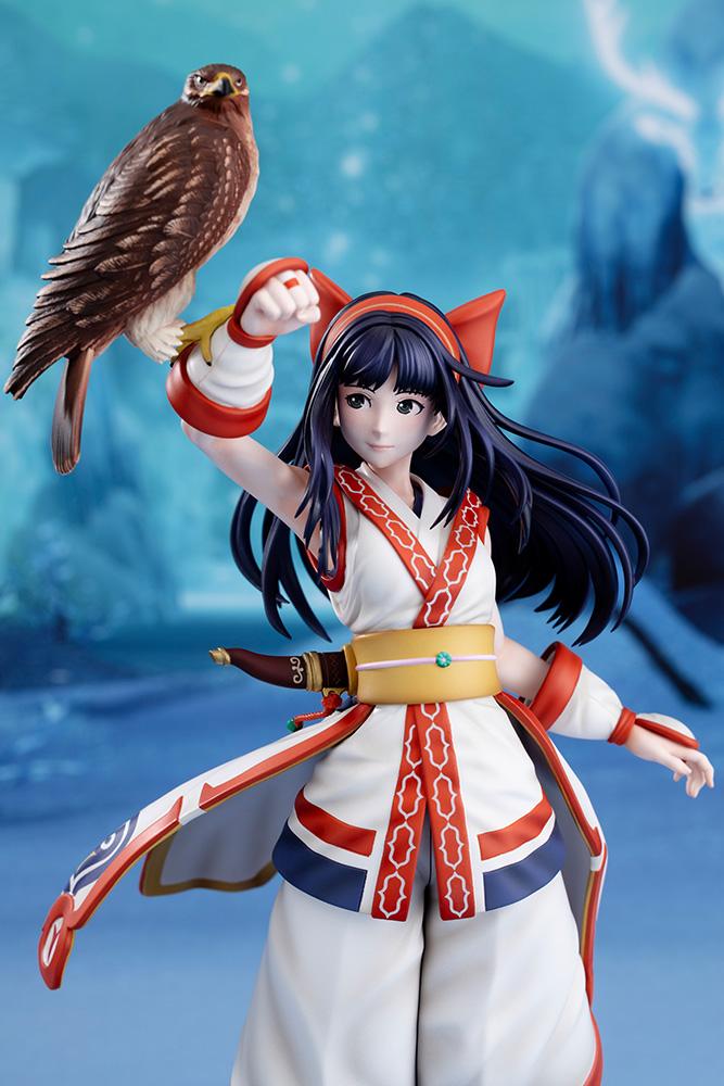 Half-body shot of Nakoruru figure showing fine paintwork and facial expression against a stylized blue backdrop