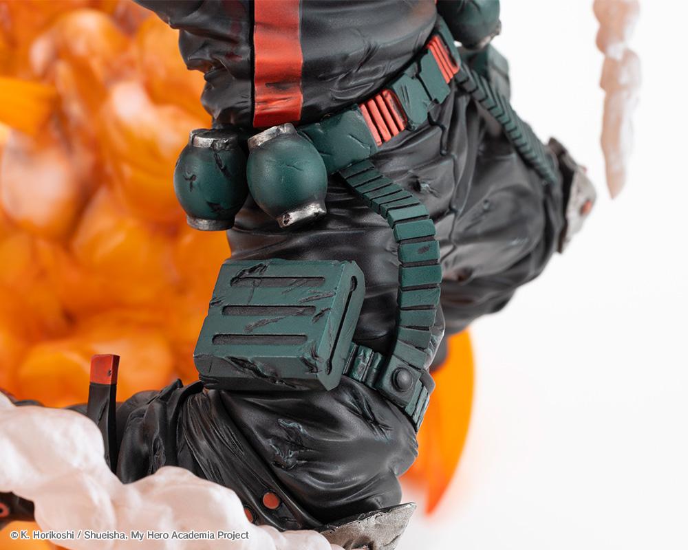 Close-up shot of Katsuki Bakugo figure leg armor, textured pants, grenade canisters, and weathered utility pouch.