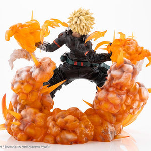 Rear back view of Katsuki Bakugo ARTFX J figure highlighting spiky blonde hair, black hero suit, and billowing smoke effect base.