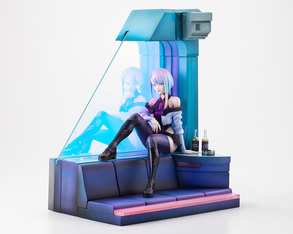 Kotobukiya Cyberpunk: Edgerunners Lucy 1/7 scale figure seated on room sofa diorama base with unlit Aurora Finish window panel.