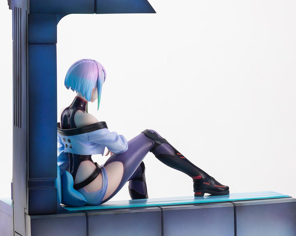 Low-angle rear view of Lucy figure looking out the window ledge showing hair sculpt and cropped jacket details.