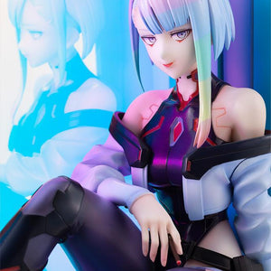 Close-up portrait of Lucy featuring rainbow hair and netrunner suit with her reflection cast on the glass panel.