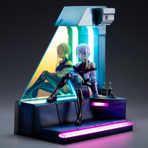Lucy 1/7 scale figure and diorama base illuminated with vibrant pink and cyan LED neon lighting in dark setting.