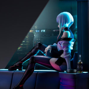 Side perspective of Lucy seated beside the glowing Night City window panel under neon room lights.