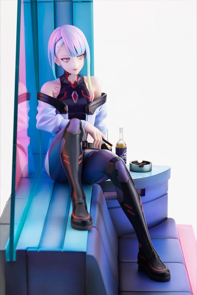 High-angle view of Lucy seated on diorama sofa holding a cigarette next to table with ashtray and Broseph drinks.