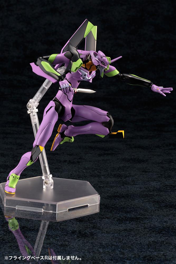 Dynamic leaping combat pose of the Kotobukiya EVA-01 model kit attacking downward with the Progressive Knife accessory.