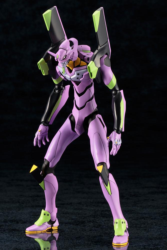 Fully assembled purple and green Kotobukiya EVA-01 Test Type model kit in a wide, dynamic ready stance.