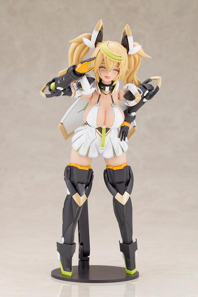 Close-up front view of the Kotobukiya Gene Stellatears model kit figure posing with a cheerful salute and closed-eye smile on a black base.