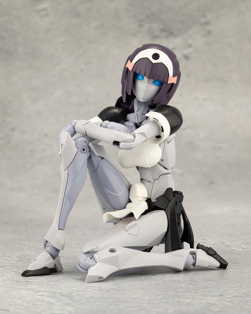 Front view of Kotobukiya Megalomaria Novice resting casually in a relaxed seated kneeling pose.