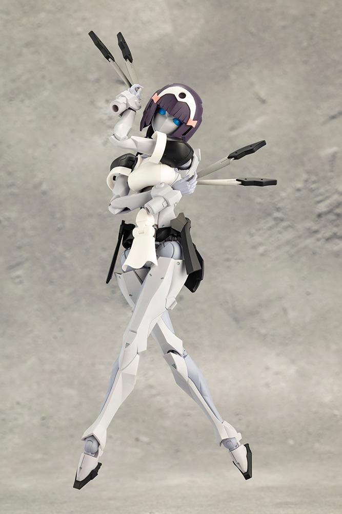 Kotobukiya Megalomaria Novice model kit standing in an elegant crossed-arms pose holding multiple throwing knives.