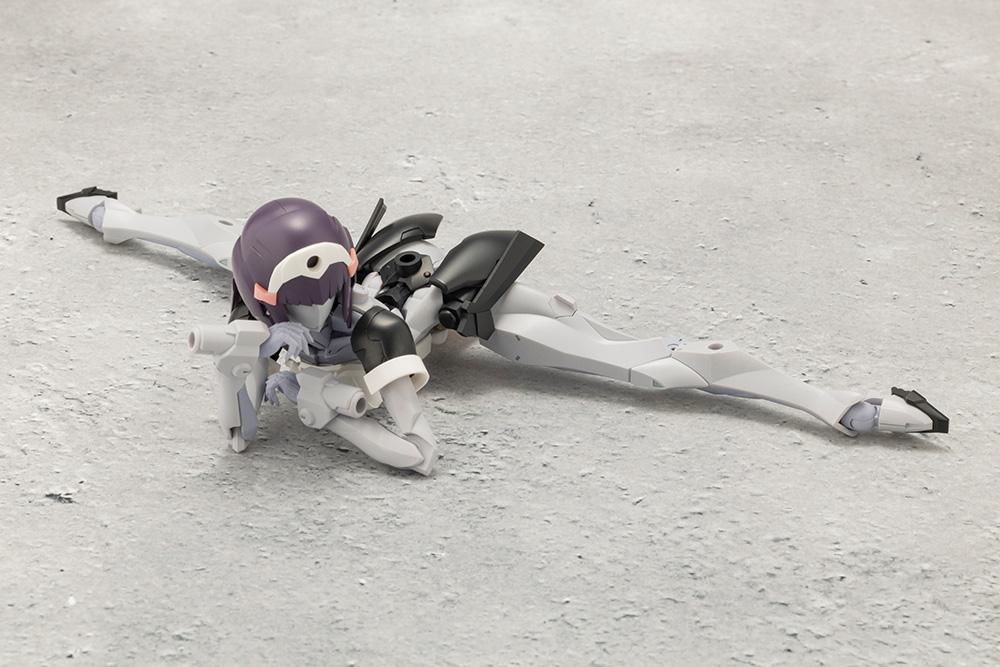 Kotobukiya Megalomaria Novice model kit demonstrating extreme hip and leg articulation in a full floor split pose.