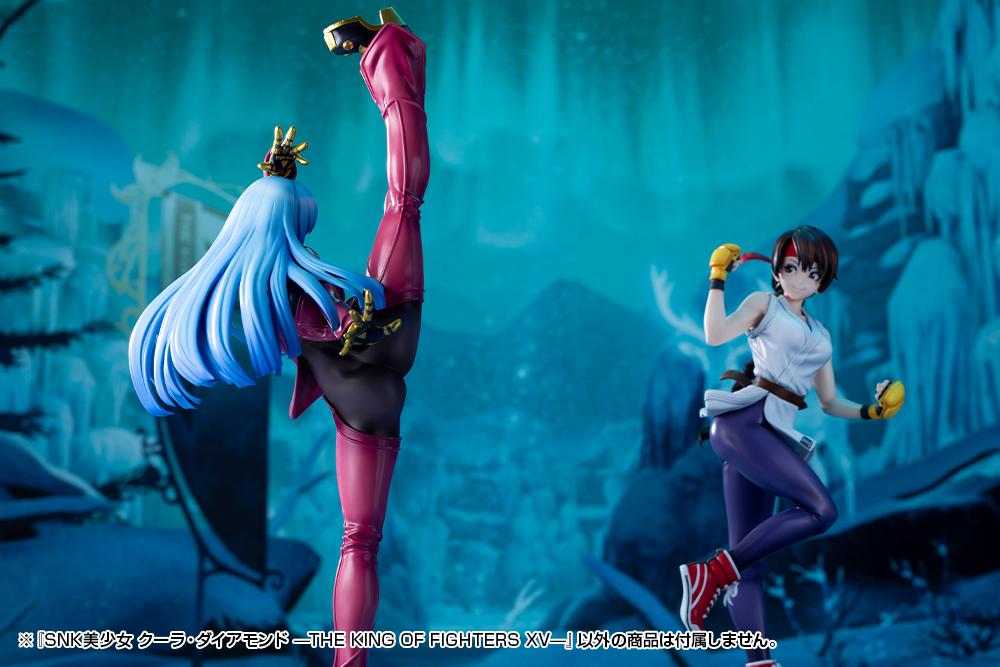 Kotobukiya Kula Diamond figure shown from behind facing a Mai Shiranui Bishoujo figure on an atmospheric winter backdrop.