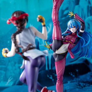Front profile of the Kula Diamond scale statue contrasted with a blurry side view of the Mai Shiranui collectible statue.