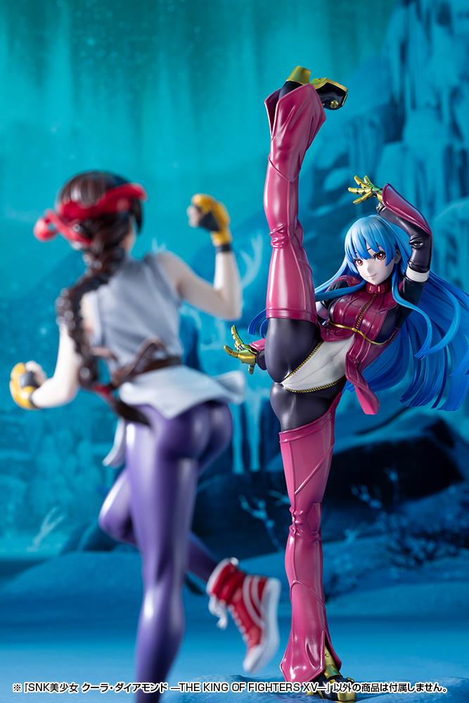 Front profile of the Kula Diamond scale statue contrasted with a blurry side view of the Mai Shiranui collectible statue.