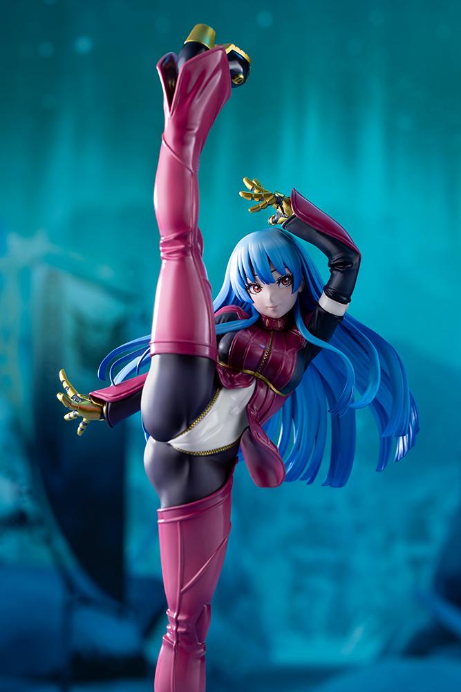 Dramatic studio shot of the Kula Diamond scale figure lit against a stylized teal, dark atmospheric Freezing Forest game stage background.