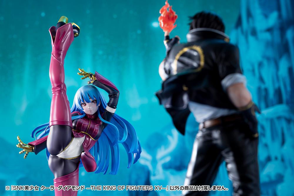 Studio display of Kotobukiya's Kula Diamond figure positioned opposite a blurred out Kyo Kusanagi figure holding a flame.