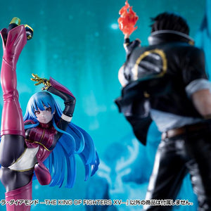 Studio display of Kotobukiya's Kula Diamond figure positioned opposite a blurred out Kyo Kusanagi figure holding a flame.