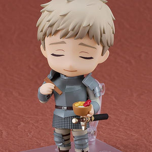 Laios Nendoroid with eyes closed enjoying a bowl of scorpion hotpot while holding chopsticks.