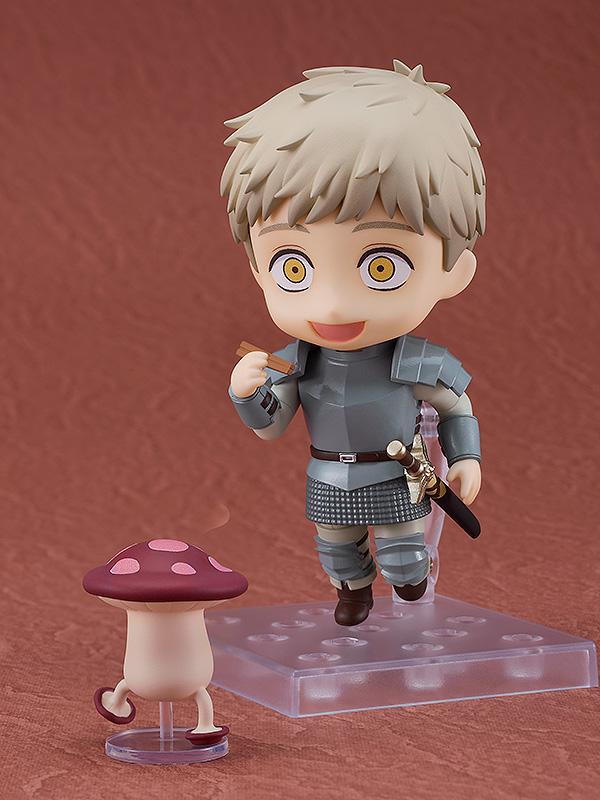 A happy smiling Laios Nendoroid holding chopsticks and chasing a walking mushroom for a dungeon meal.
