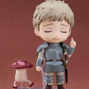 Laios Nendoroid with closed eyes face plate gesturing toward a red Walking Mushroom monster accessory.