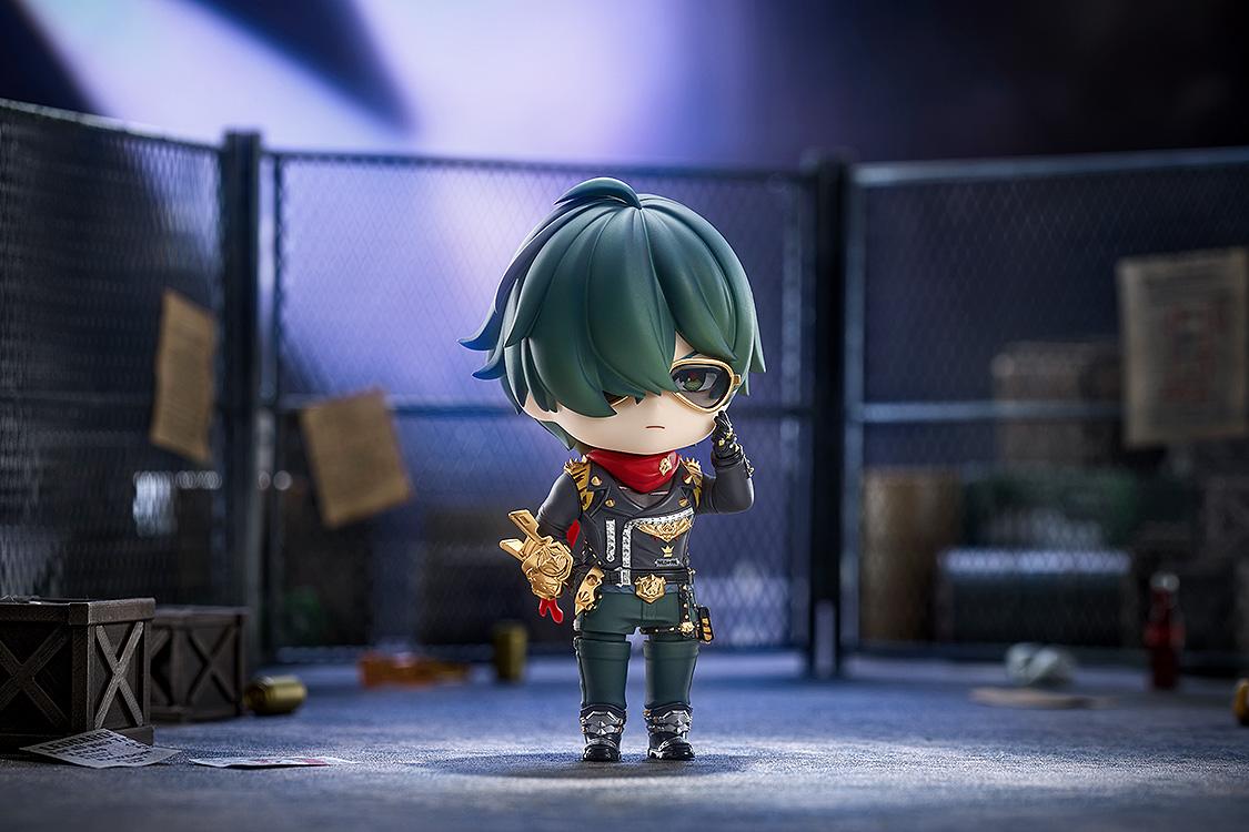 Cinematic wide diorama shot of the Lighter Nendoroid with a serious expression, adjusting his sunglasses in an urban back-alley with chain-link fences.