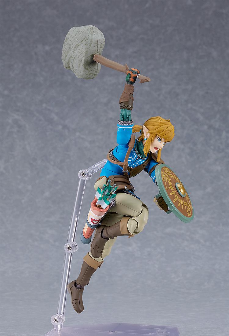 High-action jumping pose of the Link figma about to strike with the Rock Hammer accessory.