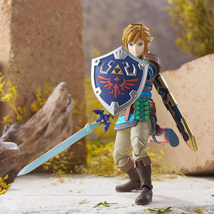 Wide cinematic shot of the figma Link action figure in a combat-ready stance with the Master Sword.