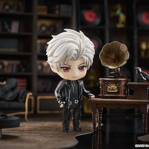 Sylus Nendoroid figure standing beside a vintage gramophone table with crow Mephisto perched in a study diorama.