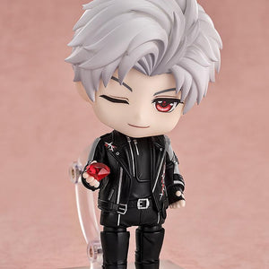 Sylus Nendoroid figure winking while holding a large translucent red ruby gem accessory.