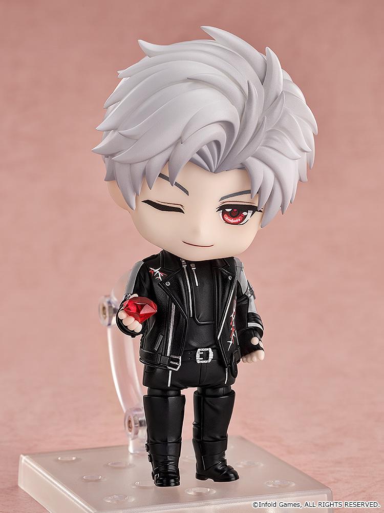 Sylus Nendoroid figure winking while holding a large translucent red ruby gem accessory.