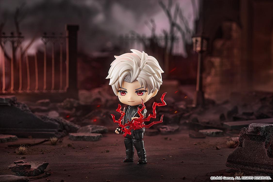Sylus Nendoroid unleashing red battle energy effects amidst a battle-ruined city street backdrop.