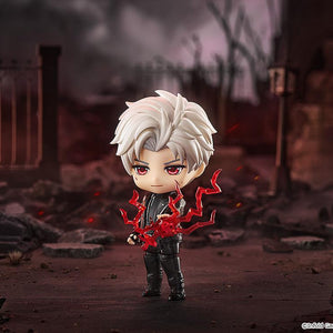 Sylus Nendoroid unleashing red battle energy effects amidst a battle-ruined city street backdrop.