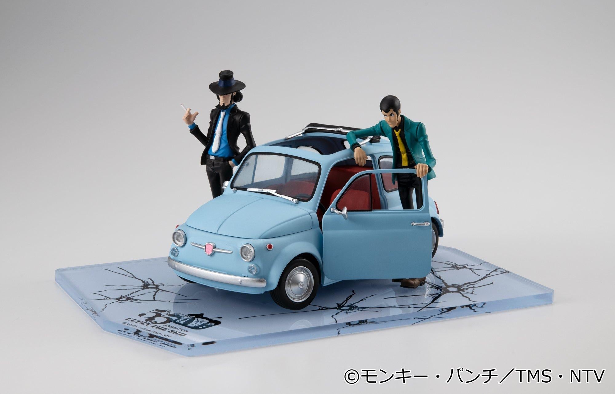 Lupin the Third and Daisuke Jigen figures posed with ice blue car on bullet-hole display base.