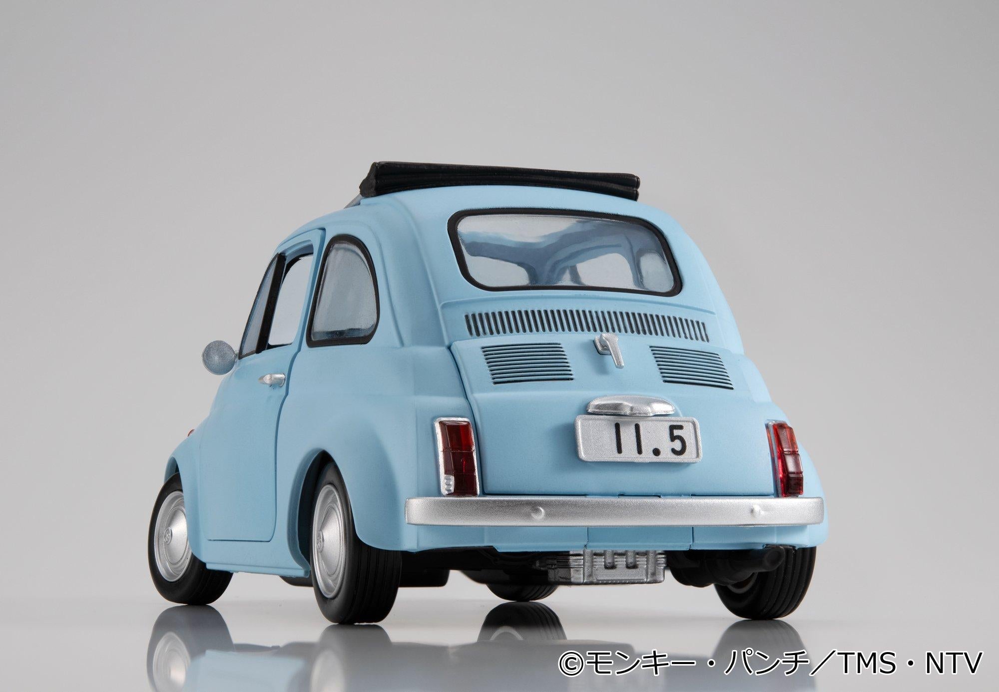 Low-angle rear view of the ice blue car highlighting tail lights and license plate detail.