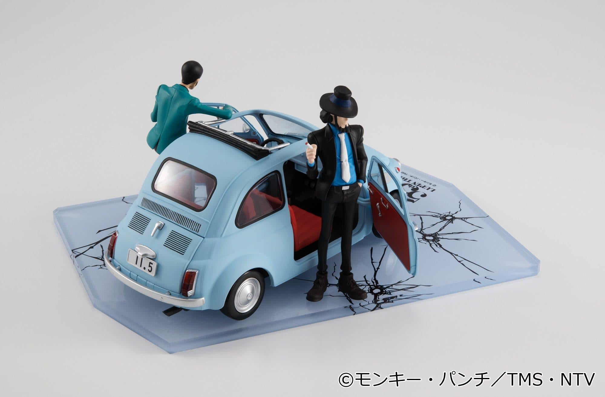 Daisuke Jigen figure standing beside the open driver door of the ice blue car.
